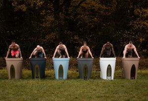 Six individuals preparing to step into a Passion Ice Bath Cold Tub.